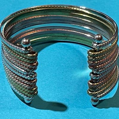 Vintage Dozen Strand Multi-Color Designer Cuff Fashion Bracelet in Very Good Preowned Condition.
