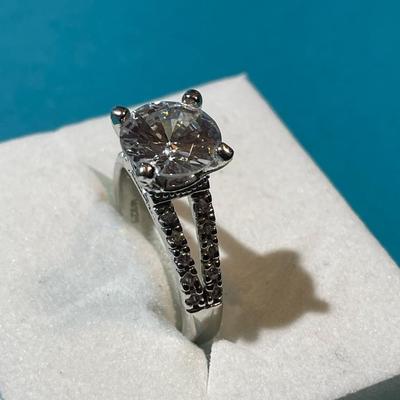 Vintage Silver-toned Fashion CZ Engagement Style Ring w/Center CZ Stone Measuring about 2-Carats in VG Preowned Condition.