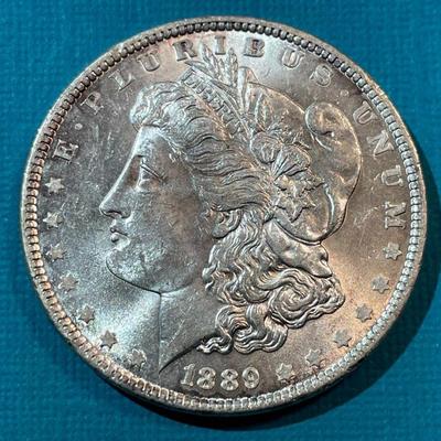 1889-P BU CONDITION MORGAN SILVER DOLLAR AS PICTURED.