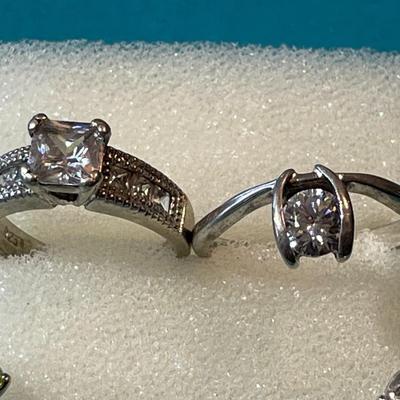 Lot of 4-Vintage Sterling Silver CZ Rings in VG Preowned Condition as Pictured.