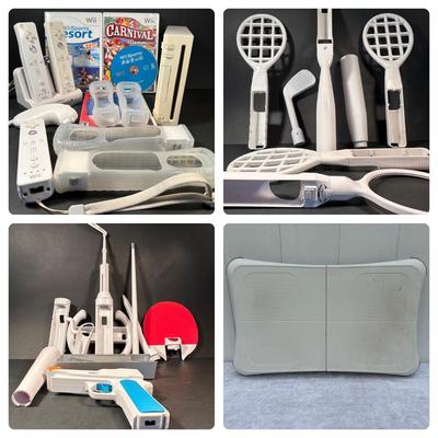 LOT 53: Nintendo Wii w/ Controllers, Controller Accessories, Games, Charge Station, Balance Board & More