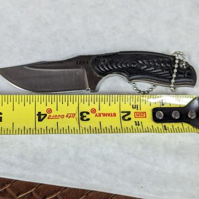 Assortment Of Knives Rope Stone