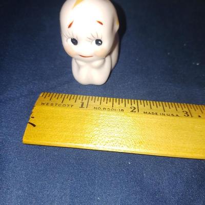 SMALL CERAMIC KEWPIE DOLLS AND A LULLABY CRADLE