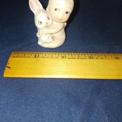 SMALL CERAMIC KEWPIE DOLLS AND A LULLABY CRADLE