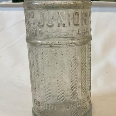 Vintage soda bottles, including Junior Grand Forks, ND