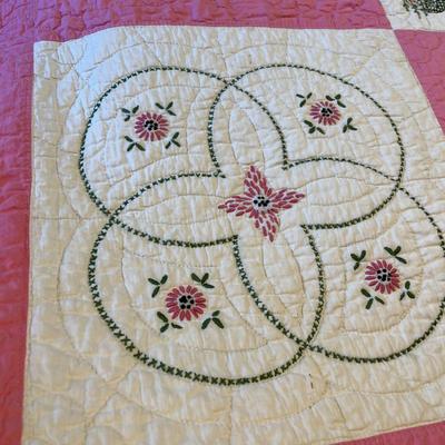 Pink embroidered quilt