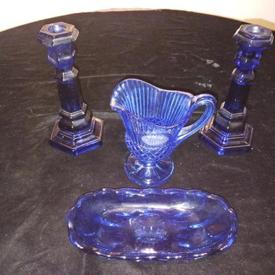BLUE GLASS CANDLESTICKS, CREAMER AND RELISH DISH