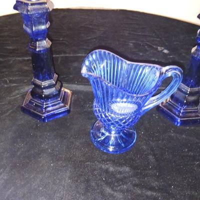 BLUE GLASS CANDLESTICKS, CREAMER AND RELISH DISH
