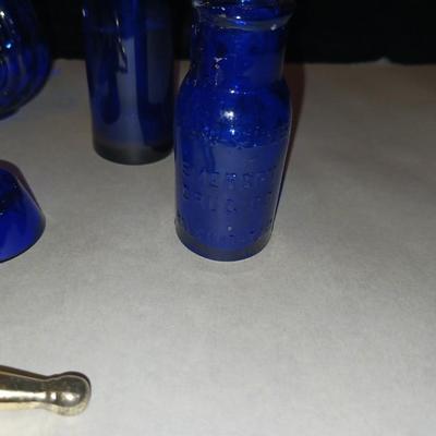 A COLLECTION OF BLUE GLASS