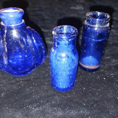 A COLLECTION OF BLUE GLASS