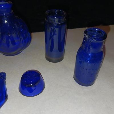 A COLLECTION OF BLUE GLASS