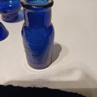 A COLLECTION OF BLUE GLASS