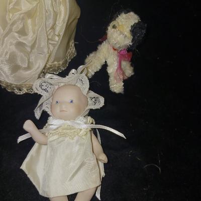 SLEEPY EYE DOLL AND 3 PORCELAIN DOLLS