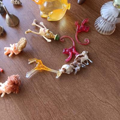 SMALL BRASS BELLS AND AN ASSORTMENT OF PLASTIC FIGURES
