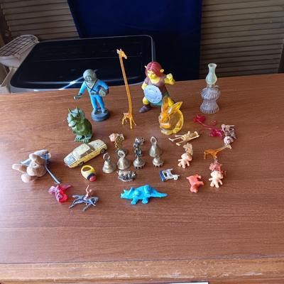 SMALL BRASS BELLS AND AN ASSORTMENT OF PLASTIC FIGURES
