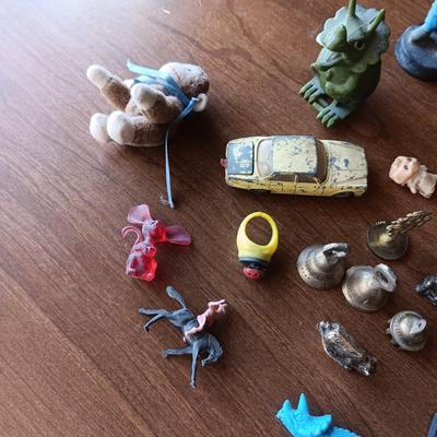 SMALL BRASS BELLS AND AN ASSORTMENT OF PLASTIC FIGURES