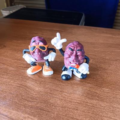 SMALL BRASS BELLS AND AN ASSORTMENT OF PLASTIC FIGURES