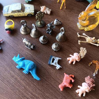 SMALL BRASS BELLS AND AN ASSORTMENT OF PLASTIC FIGURES