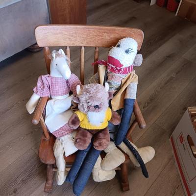 CHILD'S ROCKING CHAIR WITH SOME PLUSH ANIMALS