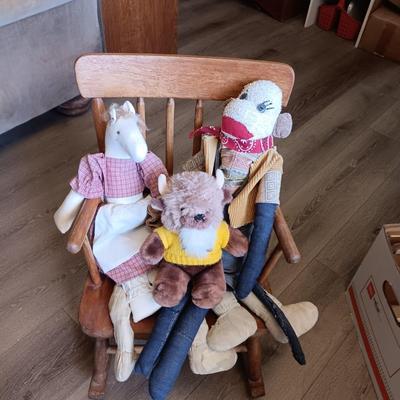 CHILD'S ROCKING CHAIR WITH SOME PLUSH ANIMALS