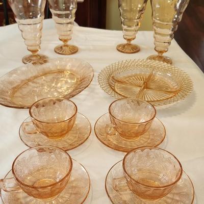 Vintage pink depression glass set, four glasses, tea cups and two serving pieces