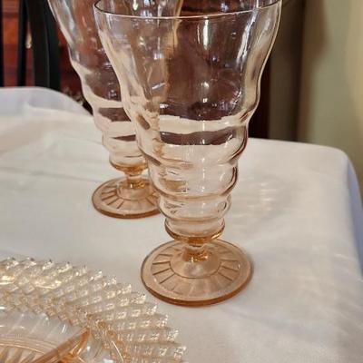 Vintage pink depression glass set, four glasses, tea cups and two serving pieces