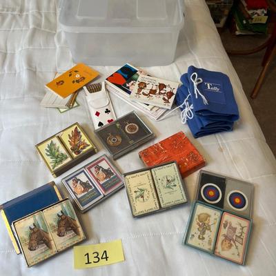 Tub of playing cards & tally sheets.