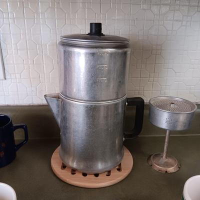 VARIETY OF COFFEE CUPS AND A PERCOLATOR