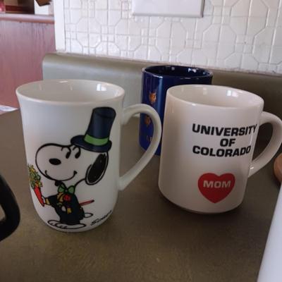 VARIETY OF COFFEE CUPS AND A PERCOLATOR