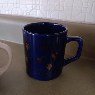 VARIETY OF COFFEE CUPS AND A PERCOLATOR