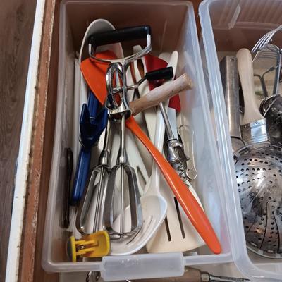 A VARIETY OF KITCHEN UTENSILS