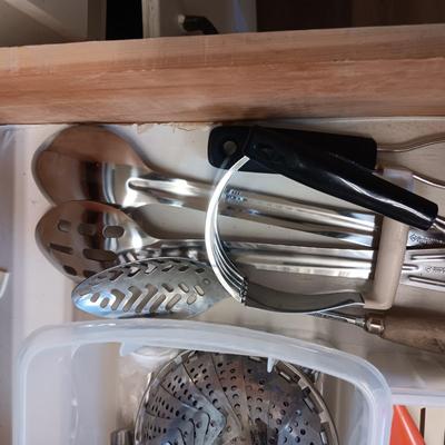A VARIETY OF KITCHEN UTENSILS