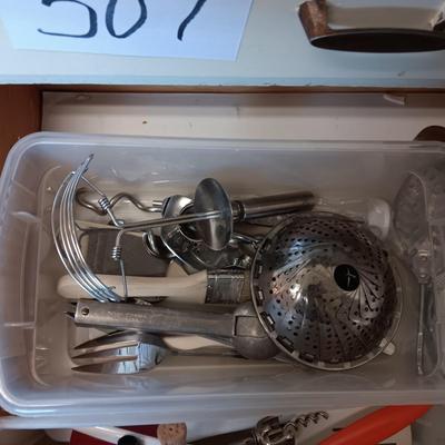 A VARIETY OF KITCHEN UTENSILS