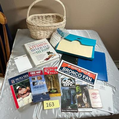 Basket of sports books and paper