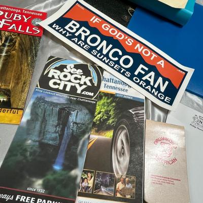 Basket of sports books and paper