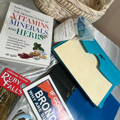 Basket of sports books and paper