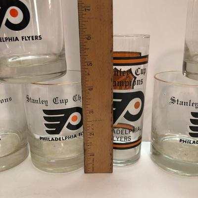 LOT 204U: Signed Philadelphia Flyer's Hockey Pucks (Tim Kerr & Ric MacLeish), Flyers Stanley Cup Glasses & Binder full of Hockey Trading...