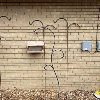SHEPHERD HOOKS AND A BIRD FEEDER