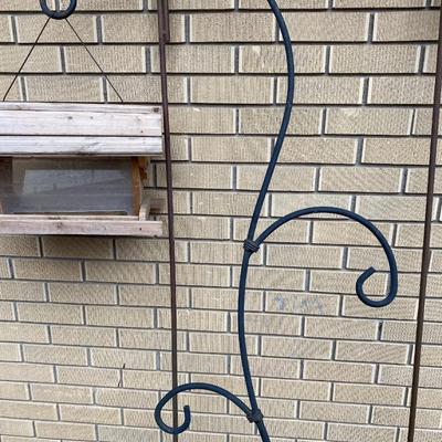 SHEPHERD HOOKS AND A BIRD FEEDER