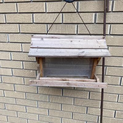 SHEPHERD HOOKS AND A BIRD FEEDER