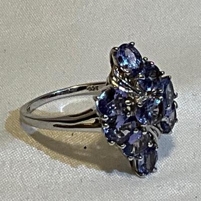 Sterling Silver size 9, lavender colored stones.
