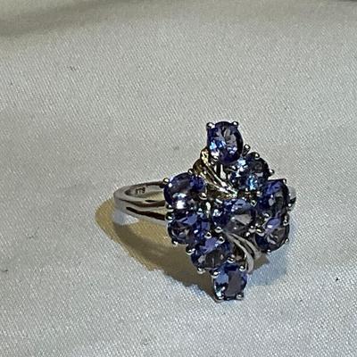 Sterling Silver size 9, lavender colored stones.
