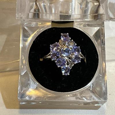Sterling Silver size 9, lavender colored stones.