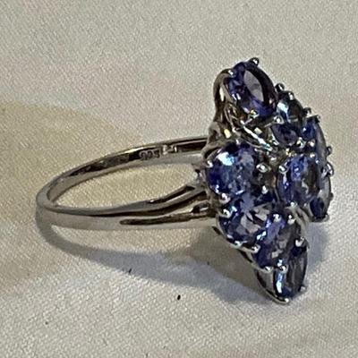 Sterling Silver size 9, lavender colored stones.
