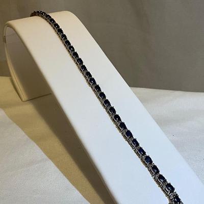 Sterling silver bracelet, stones are blue in color, 7.5in