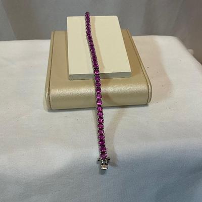Sterling silver, stones are dr pink in color 7.5in bracelet