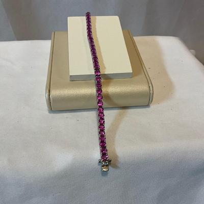 Sterling silver, stones are dr pink in color 7.5in bracelet