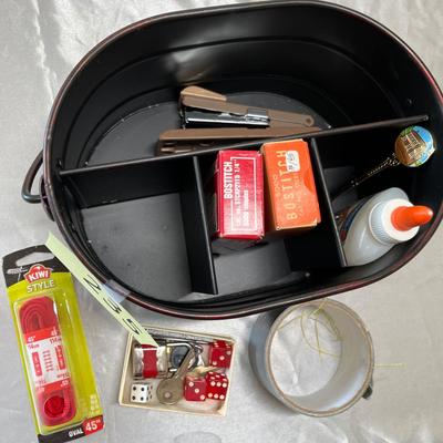 Tin basket of office supplies