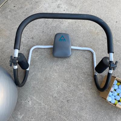 EXERCISE EQUIPMENT AND A BOX OF GOLF BALLS