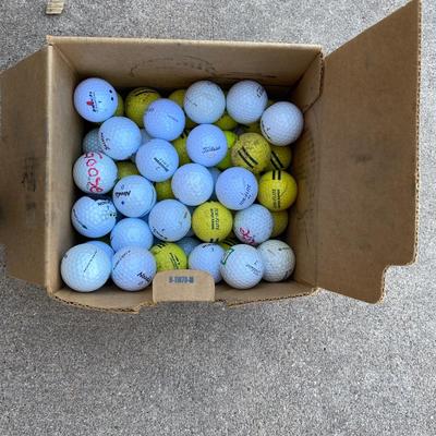EXERCISE EQUIPMENT AND A BOX OF GOLF BALLS